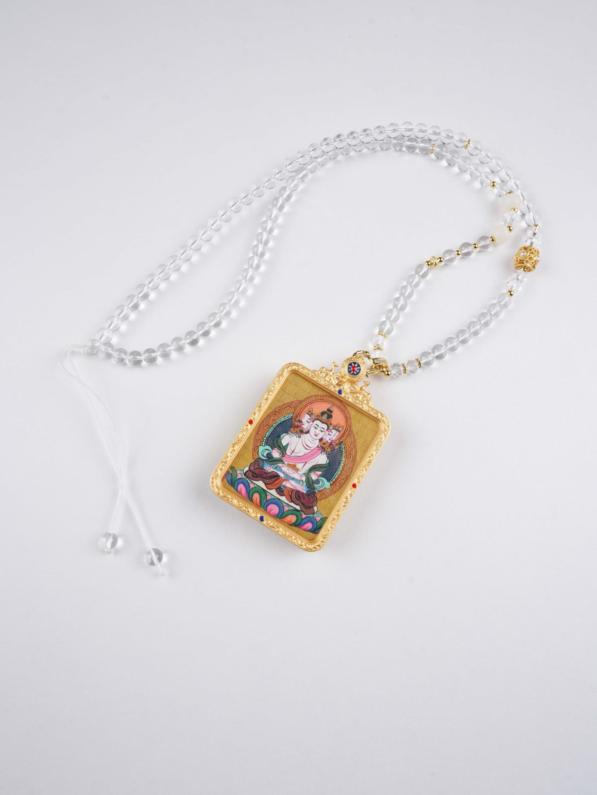 Mini Thangka pendant representing Vairocana Buddha, zodiac protector of the Dragon and Snake signs.