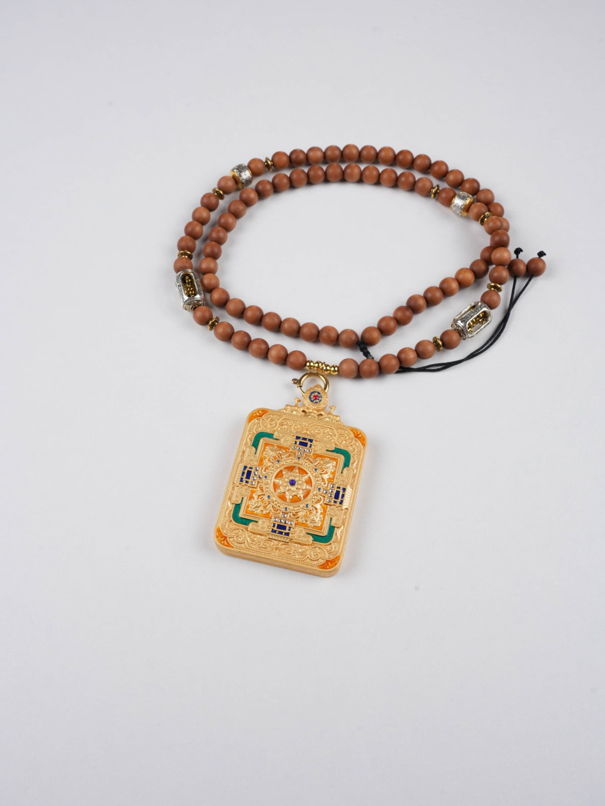 Traditional Tibetan Buddhist thangka painting of Jambhala, Wealth Deity protector pendant for abundance and good fortune.