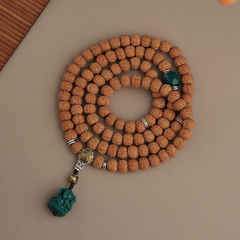 Vajra Bodhi and glass Tibetan Buddhist amulet strand, handmade with copper details.