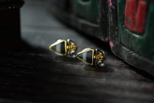 Artisanal Vajra Dagger earrings with golden obsidian and Bodhi elements, inspired by Tibetan sacred jewelry.