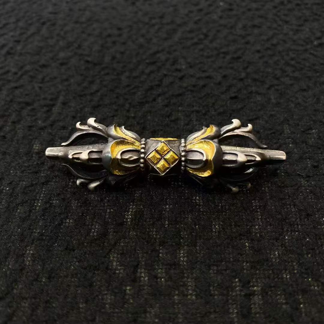 Handcrafted Tibetan Buddhist Vajra pendant featuring precious metal construction