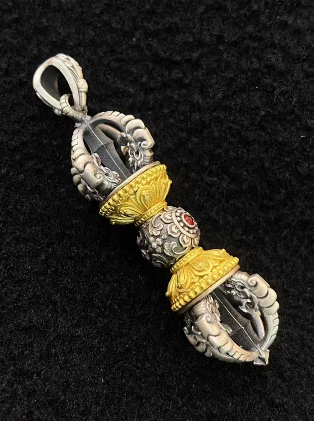 Handcrafted Tibetan-Buddhist Vajra pendant symbolizing protection and power.