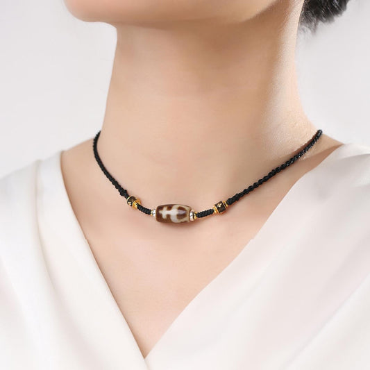 Handmade treasure vase Dzi agate necklace symbolizing abundance and purification.