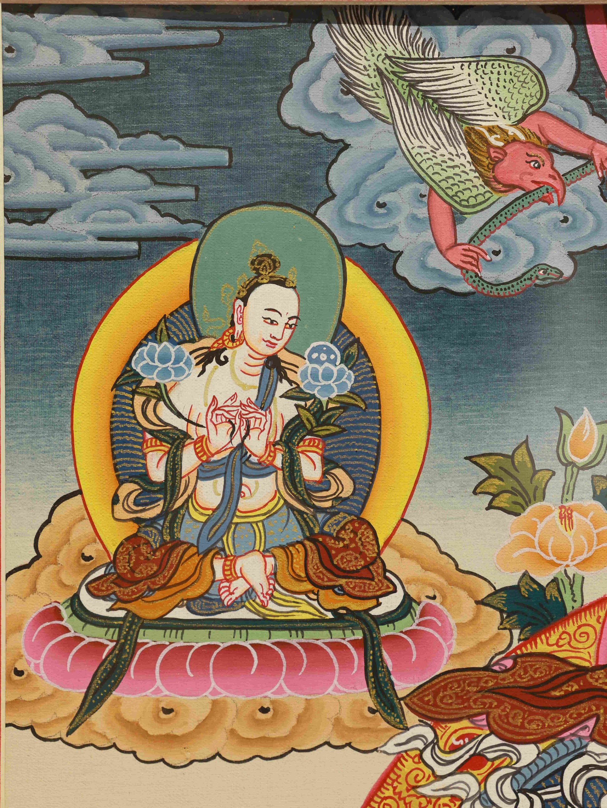 Hand-painted Tibetan Buddha Thangka depicting Yellow Jambhala, a wealth deity in Tibetan Buddhism, created with devotion and skill.