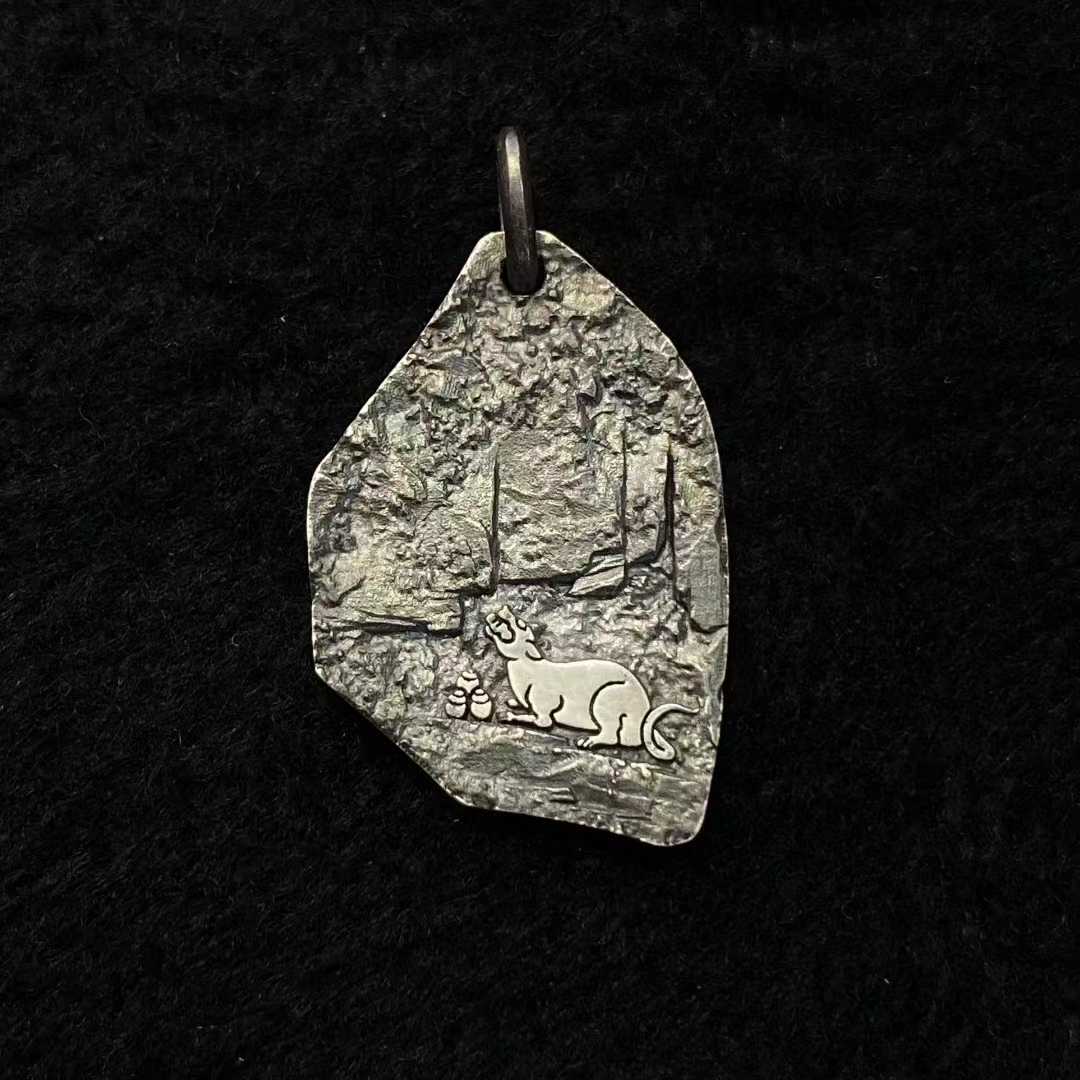 Artisan-made Yellow Dzambhala pendant in pure gold and pure silver with detailed inlay work.