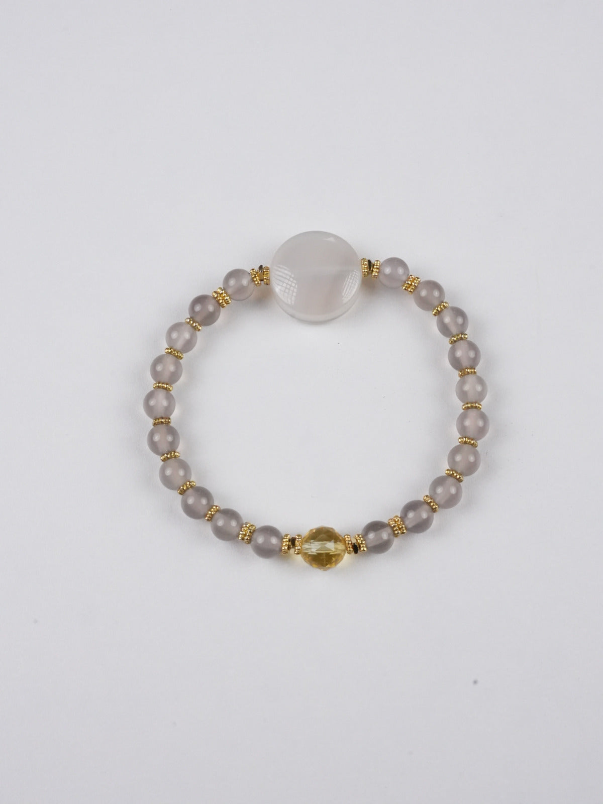 Handmade Yellow Dzambhala mini Thangka bracelet inspired by Tibetan Buddha art, symbolizing prosperity, abundance, and spiritual strength through traditional craftsmanship