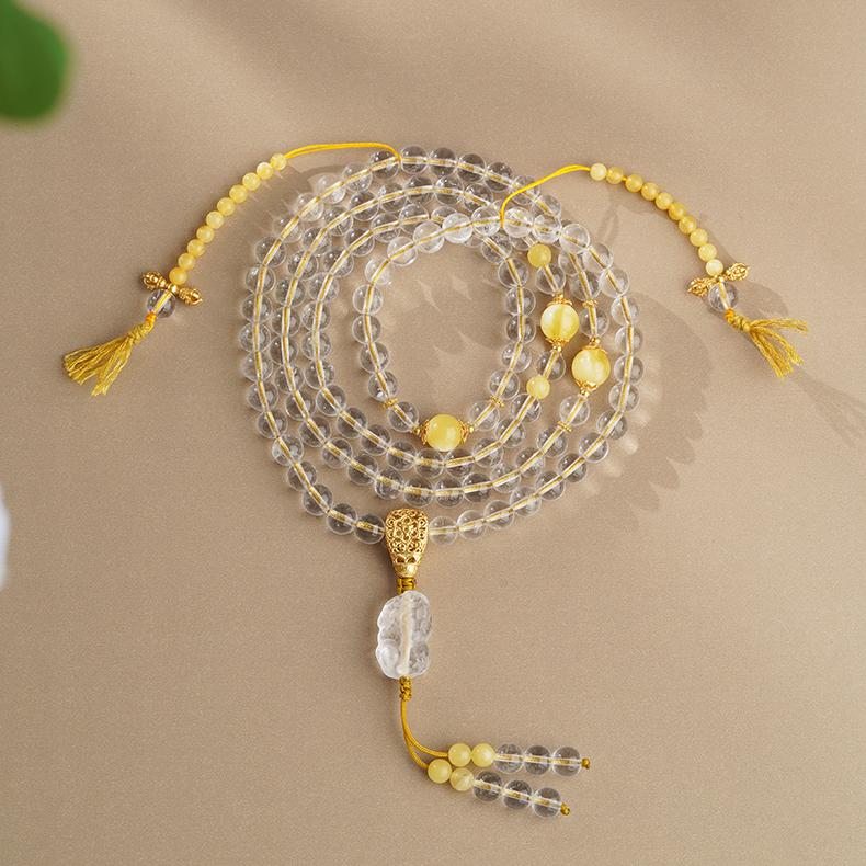 Tibetan Buddhist white crystal and amber 108 beads mala with Pi Xiu pendant for meditation and protection.