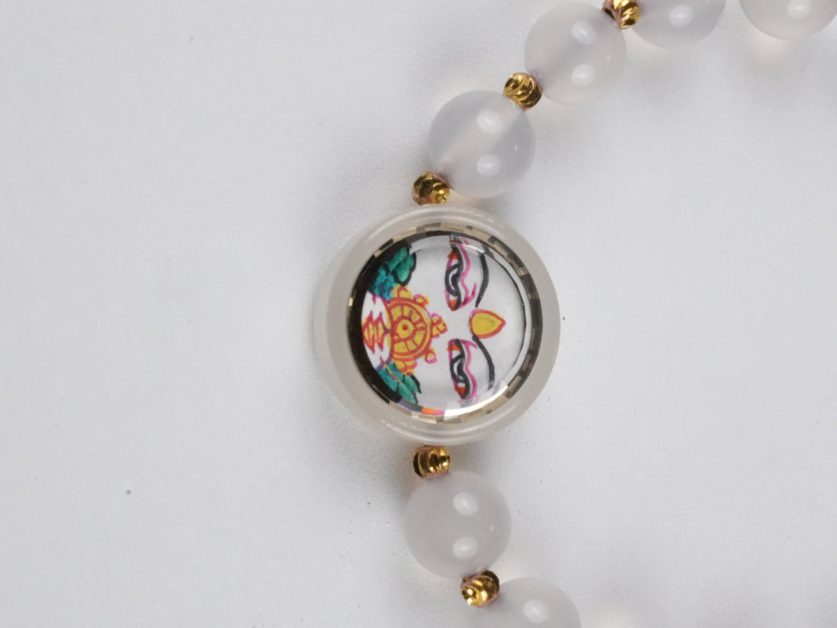 Tibetan Buddhist White Tara thangka bracelet, fully hand-painted with natural pigments, embodying compassion and healing energy.