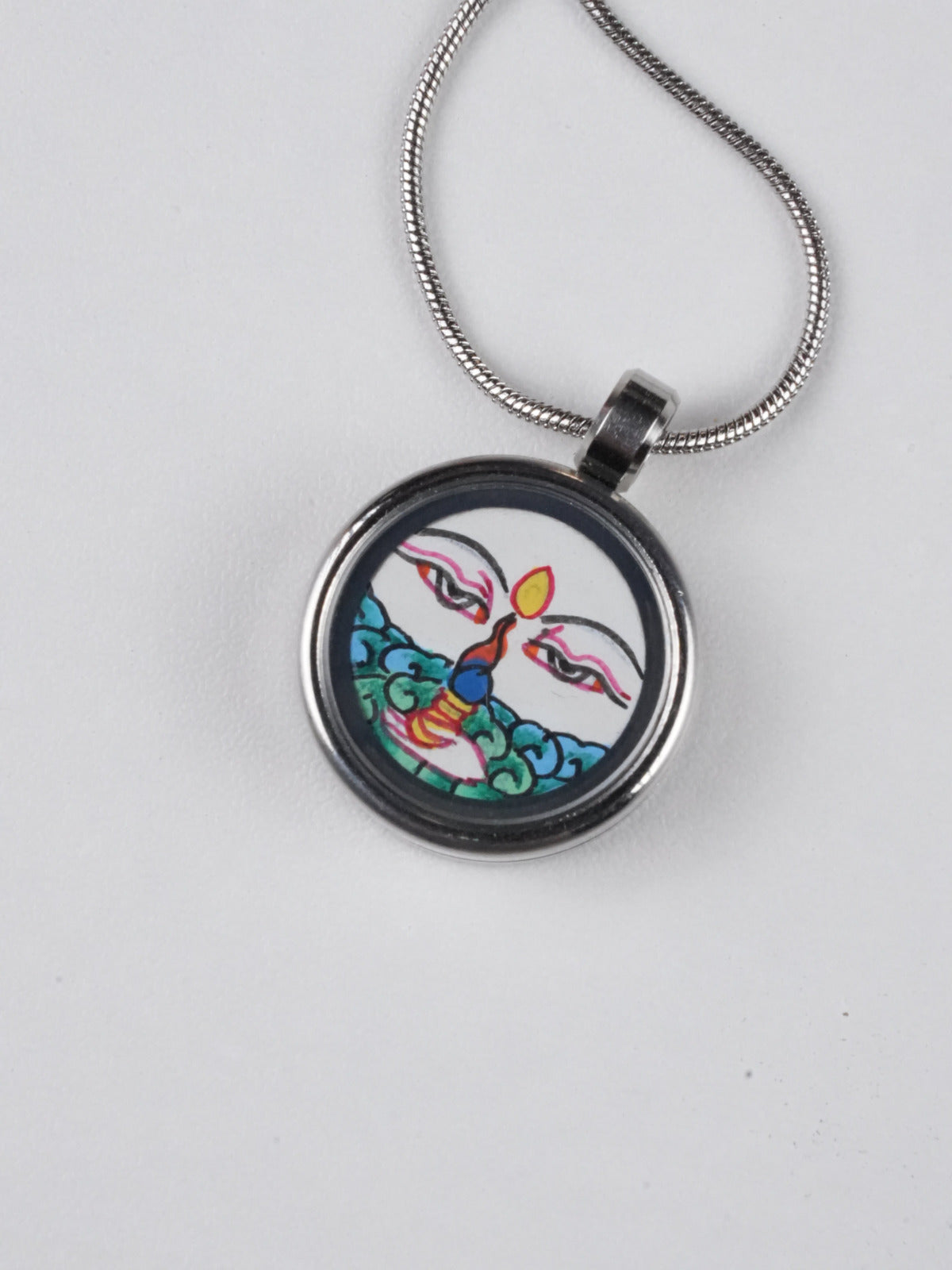 Tibetan Buddhist thangka pendant featuring White Tara, symbol of healing and peace, handmade using traditional Tibetan Buddha art techniques.