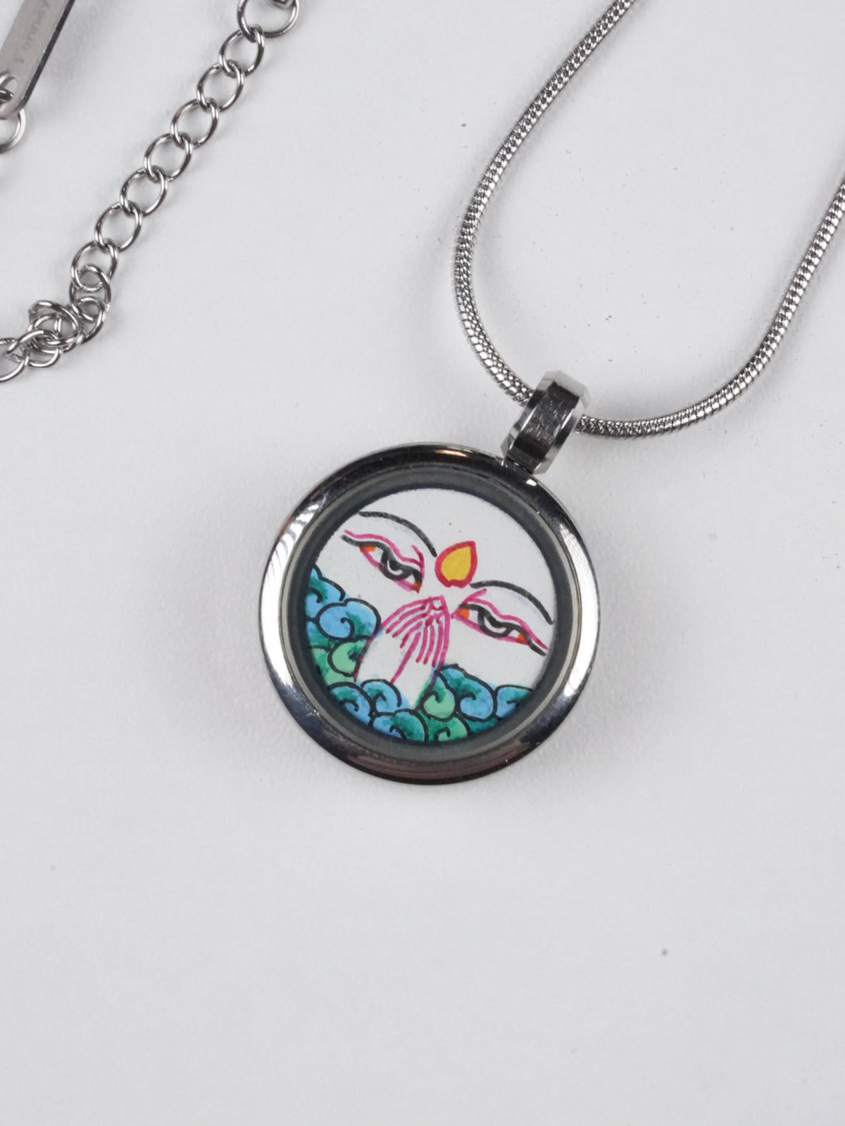 Tibetan-buddhist White Tara thangka pendant necklace, a hand-painted spiritual artwork on thangka canvas, celebrating the peaceful wisdom of Tibetan Buddha traditions.