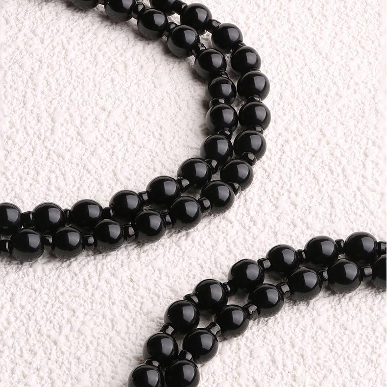Elegant Tibetan-Buddhist obsidian necklace for women, handmade for calm and balance.