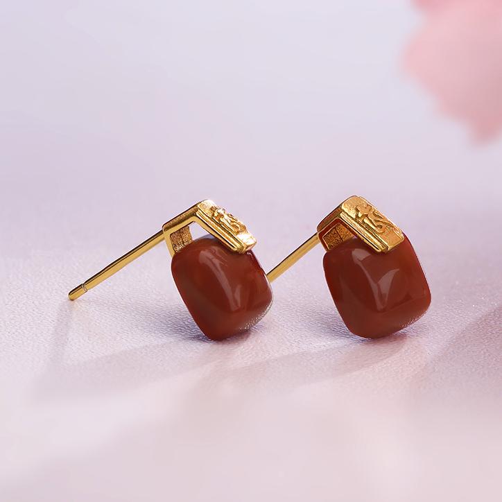 "Handmade Tibetan Buddhist Xiaozizai South Red Coral earrings with 925 silver setting, symbolizing peace and balance."