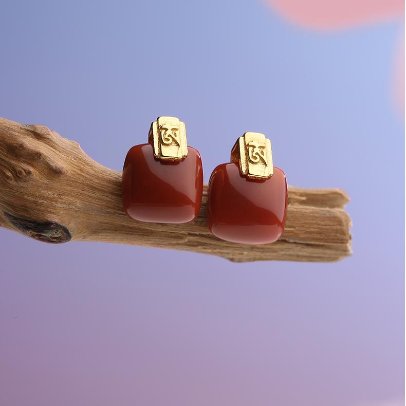 "Artisan-crafted South Red Coral earrings in 925 silver, symbolizing harmony and wisdom in Tibetan Buddhist tradition."