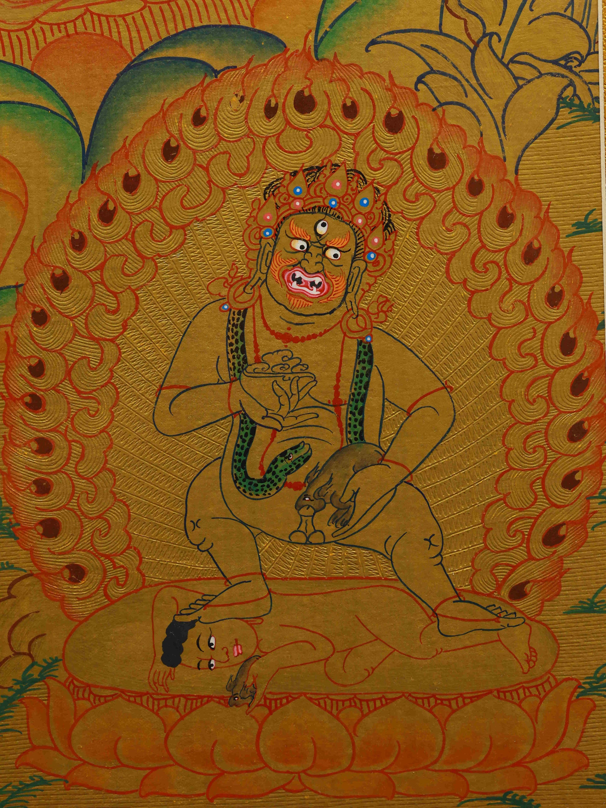 Traditional Tibetan Thangka painting of Yellow Dzambhala, hand-painted with gold foil and sacred details.