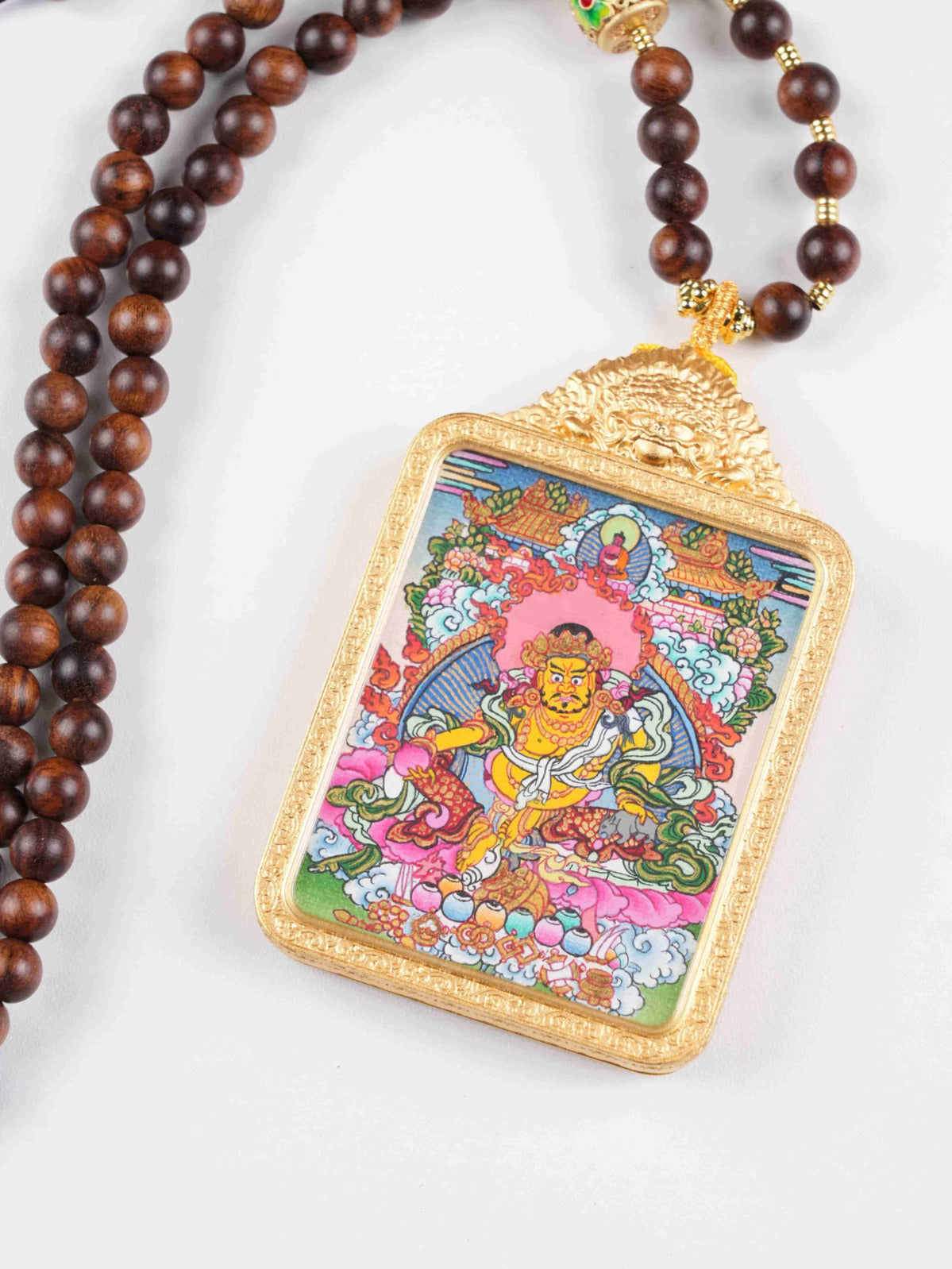 Handmade Tibetan Buddhist Yellow Jambhala thangka painting amulet for wealth and prosperity, crafted on traditional canvas.