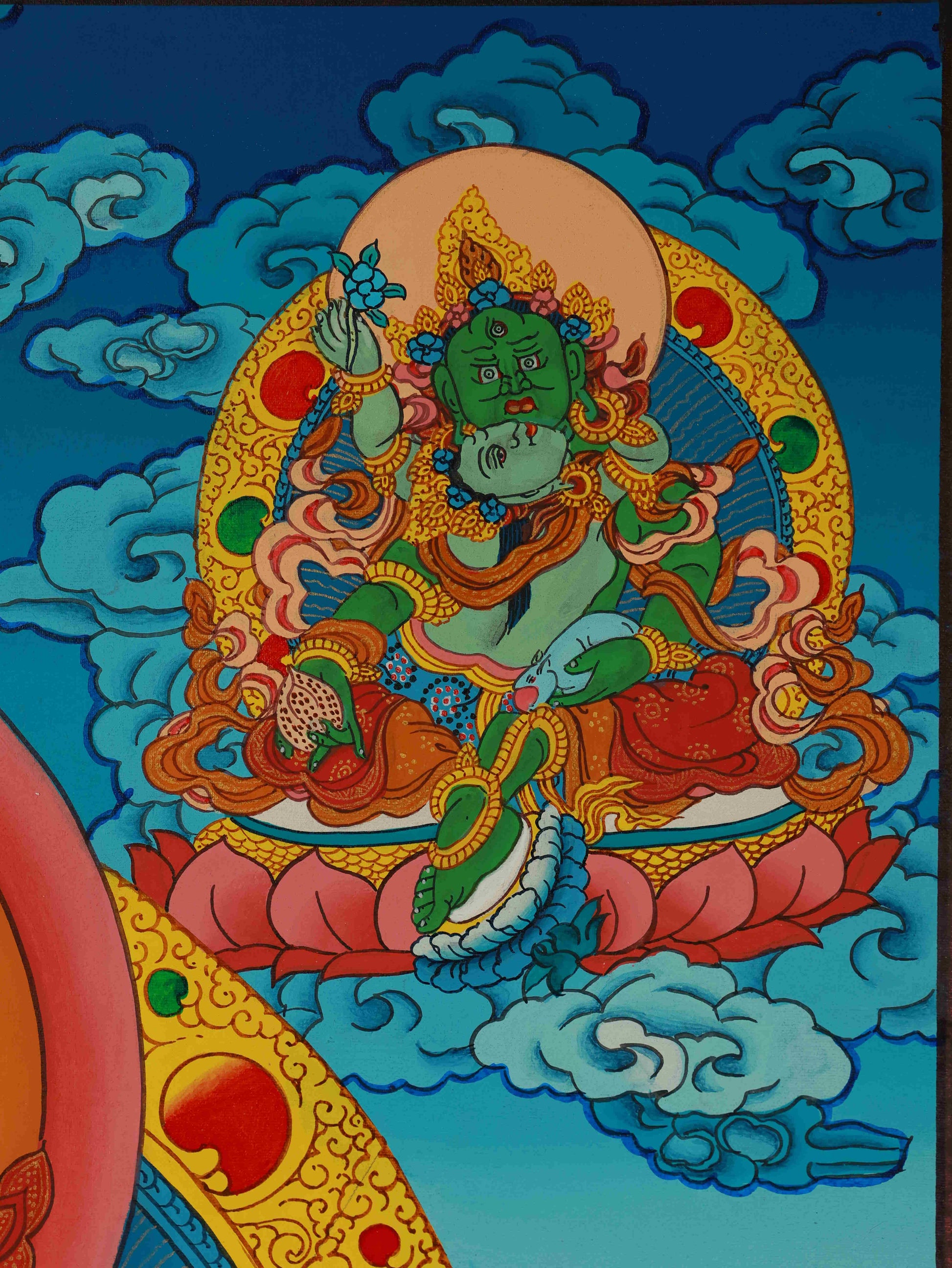 Close-up of Yellow Jambhala Thangka painting, showcasing intricate hand-painted details and mineral pigments.