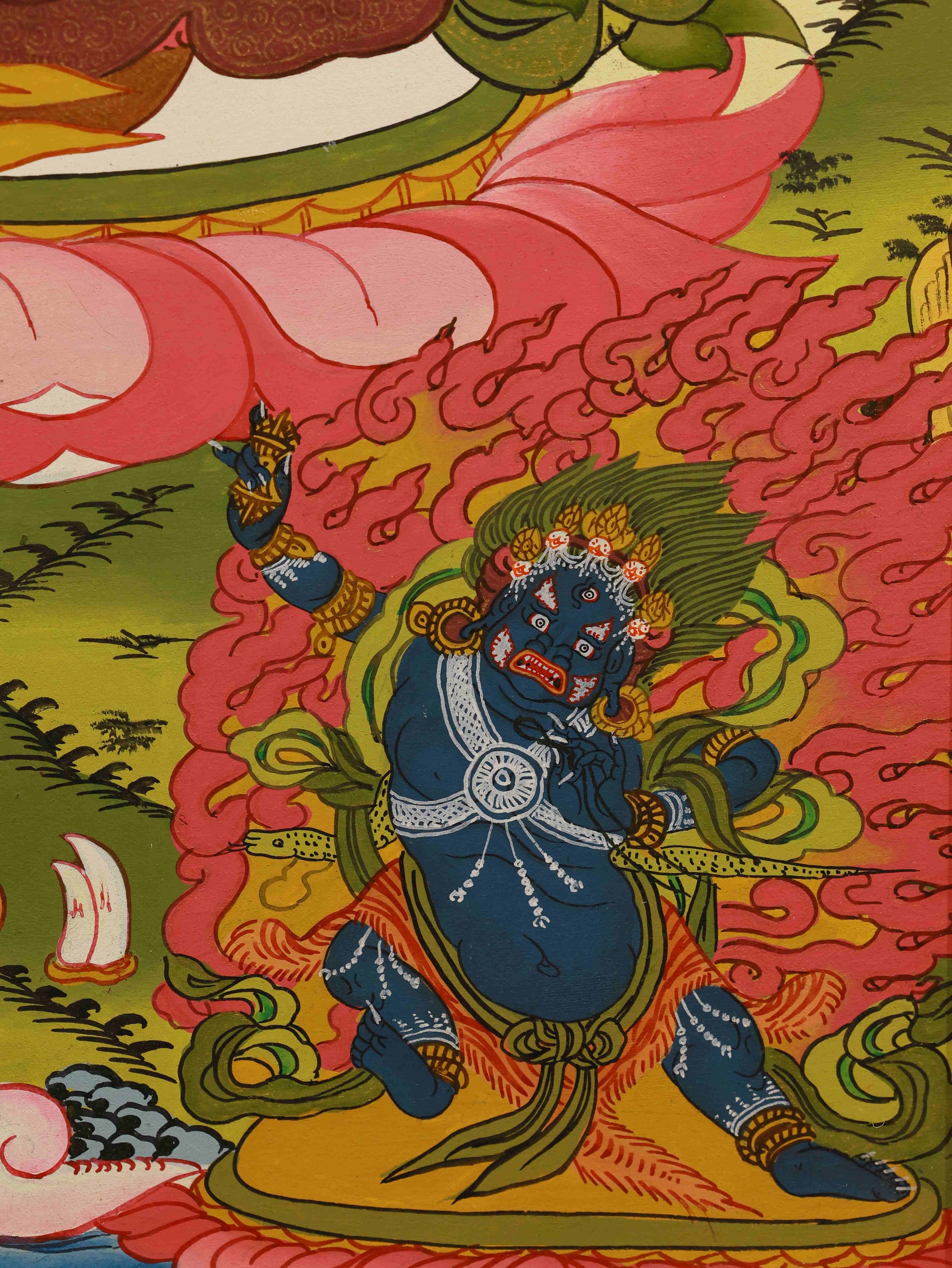 Traditional Tibetan art of Yellow Dzambhala Bodhisattva on canvas.