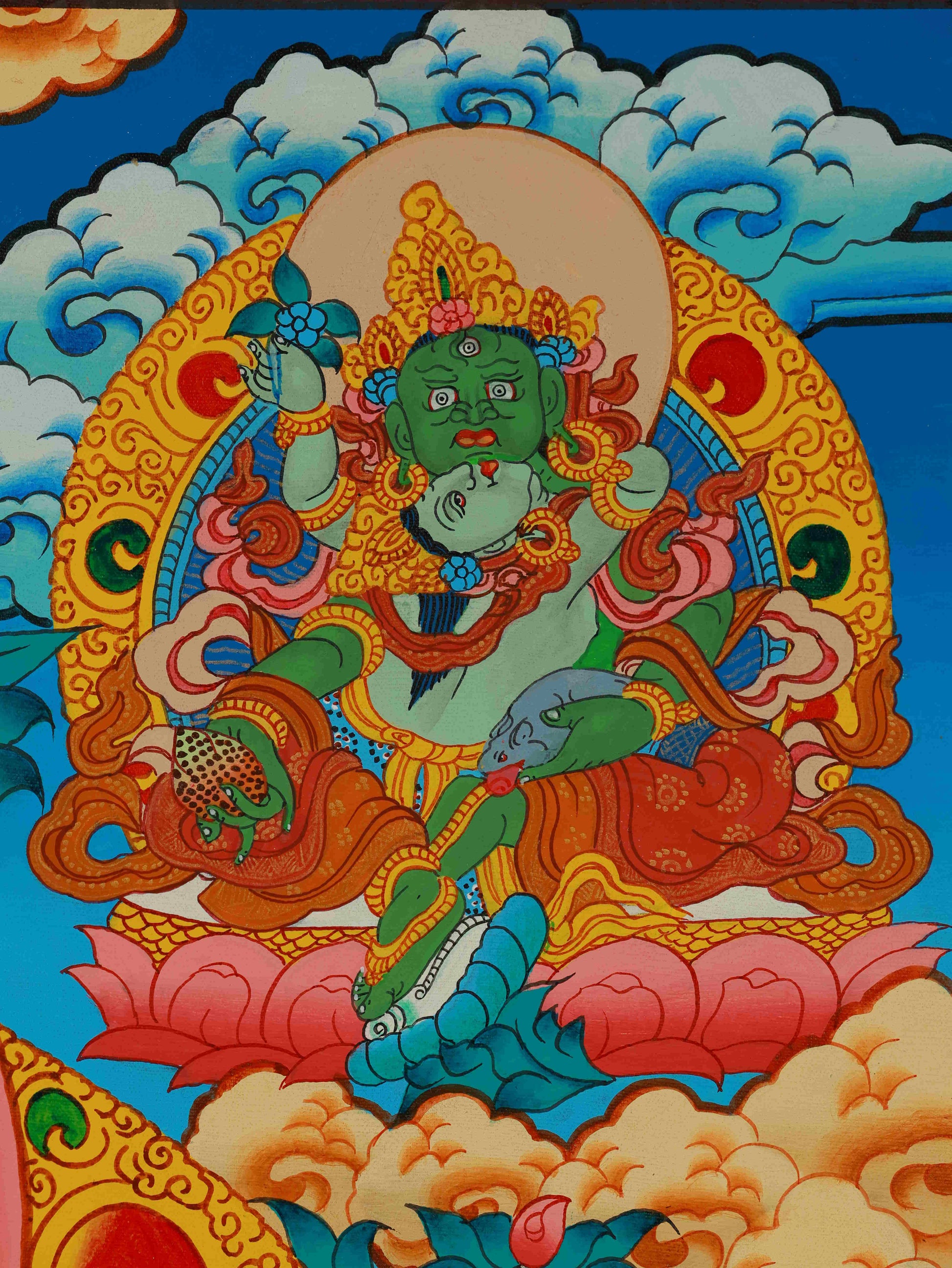 Close-up detail view of Yellow Jambhala Thangka painting, highlighting hand-painted craftsmanship and sacred colors.