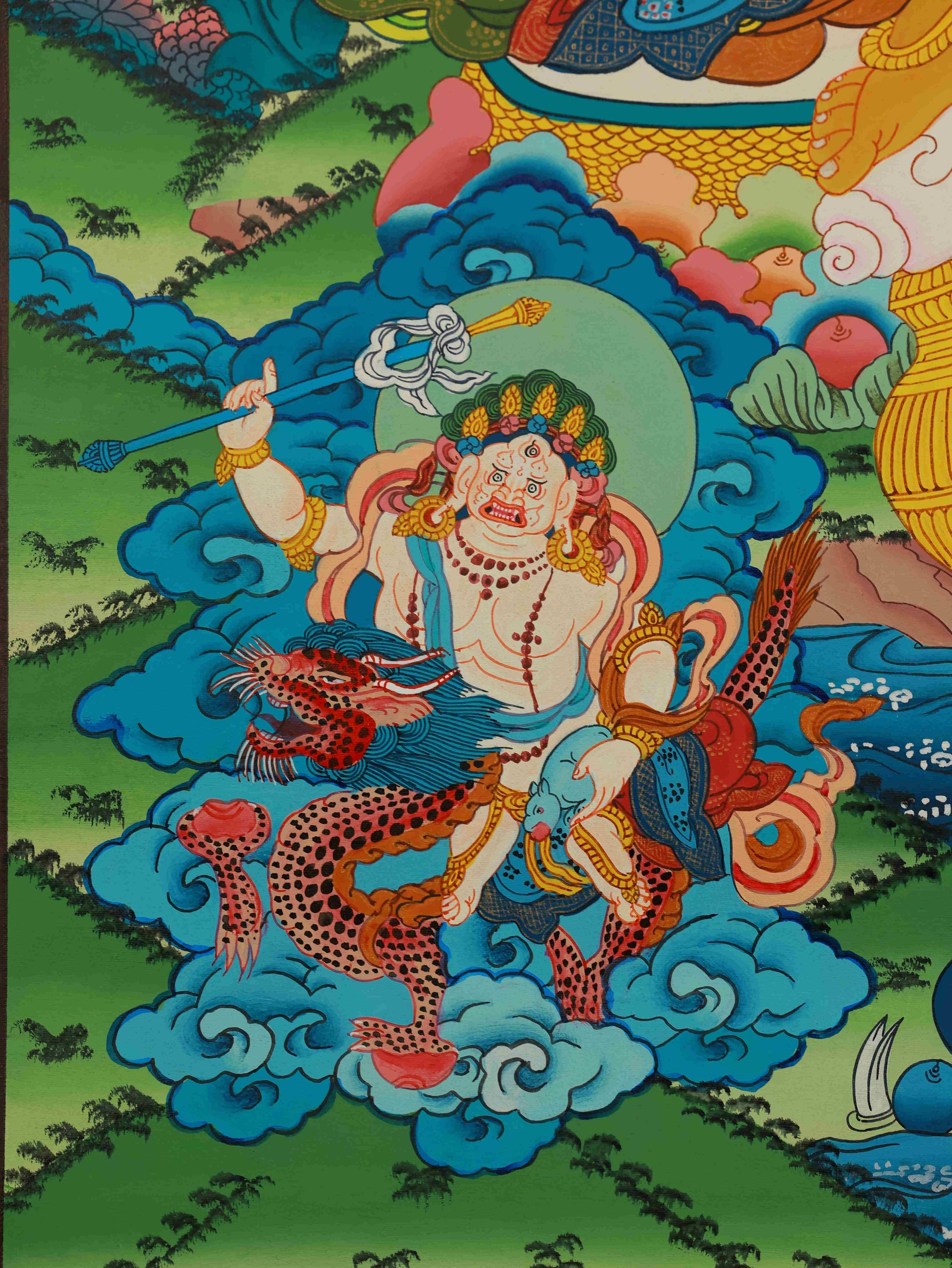 Detailed view of Yellow Jambhala Tibetan Thangka, highlighting authentic Thangka painting craftsmanship.