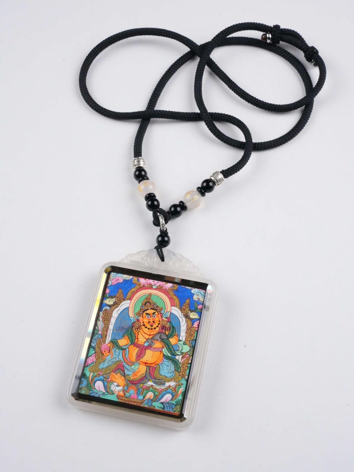 Yellow Jambhala thangka pendant with natural mineral pigments - authentic hand-painted craftsmanship