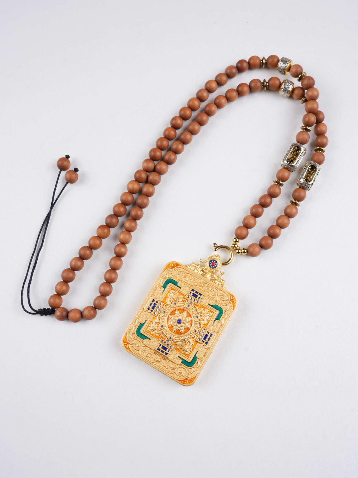 Tibetan Buddhist Yellow Jambhala pendant, a sacred hand-painted thangka for abundance and good karma.