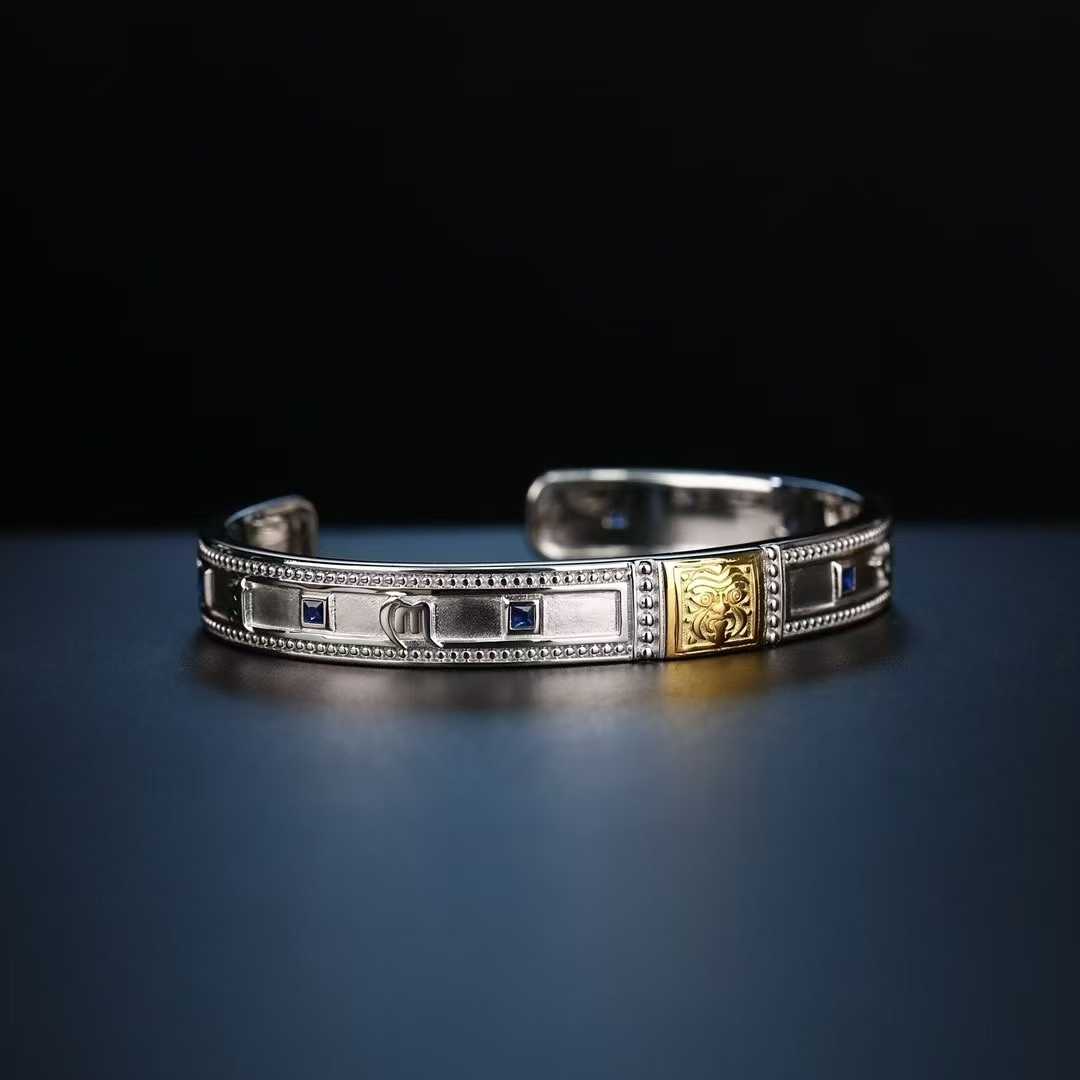 Artisan-made Zakiram bracelet with detailed Tibetan Buddhist spiritual motifs.