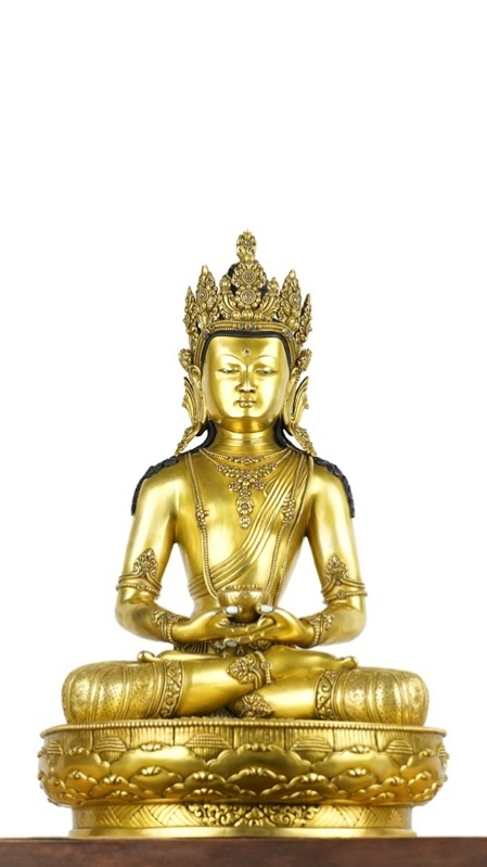 Alt Text: Gilded Zanabazar Three Lives Buddha Statue, handcrafted with mineral paint, reflecting Tibetan Buddhist artistry and spiritual significance.