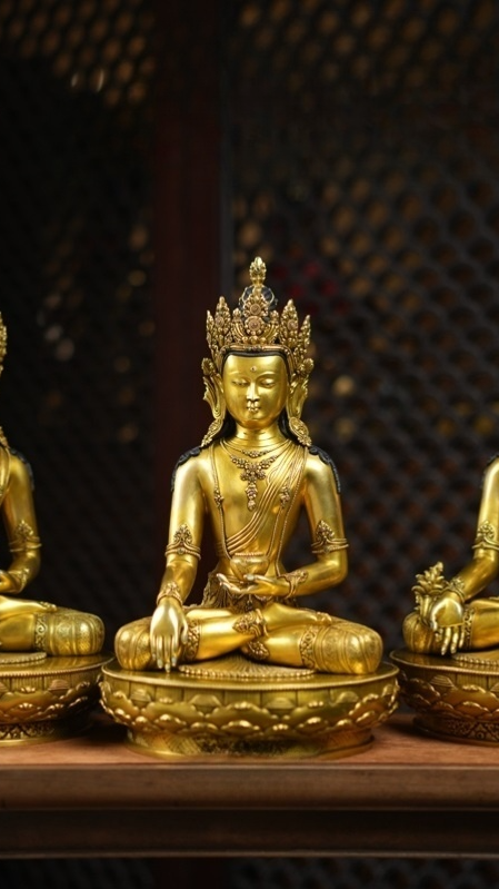 Alt Text: Handcrafted Zanabazar Three Buddhas Statue, gilded with intricate detail, embodying the profound wisdom and compassion of Tibetan Buddhism.