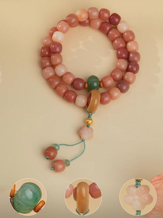 Zhaohongyan Bodhi bracelet featuring handcrafted Bodhi beads, Aventurine accents, and sterling silver mantra bead in Tibetan style.