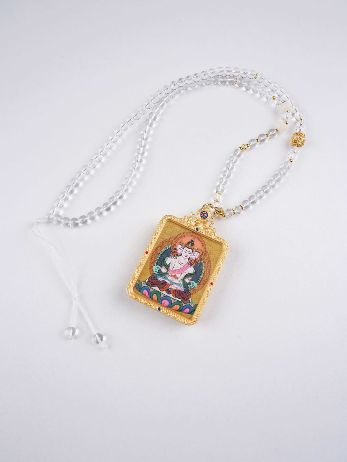 Handcrafted Vairocana Thangka pendant symbolizing divine wisdom, protection, and inner peace.