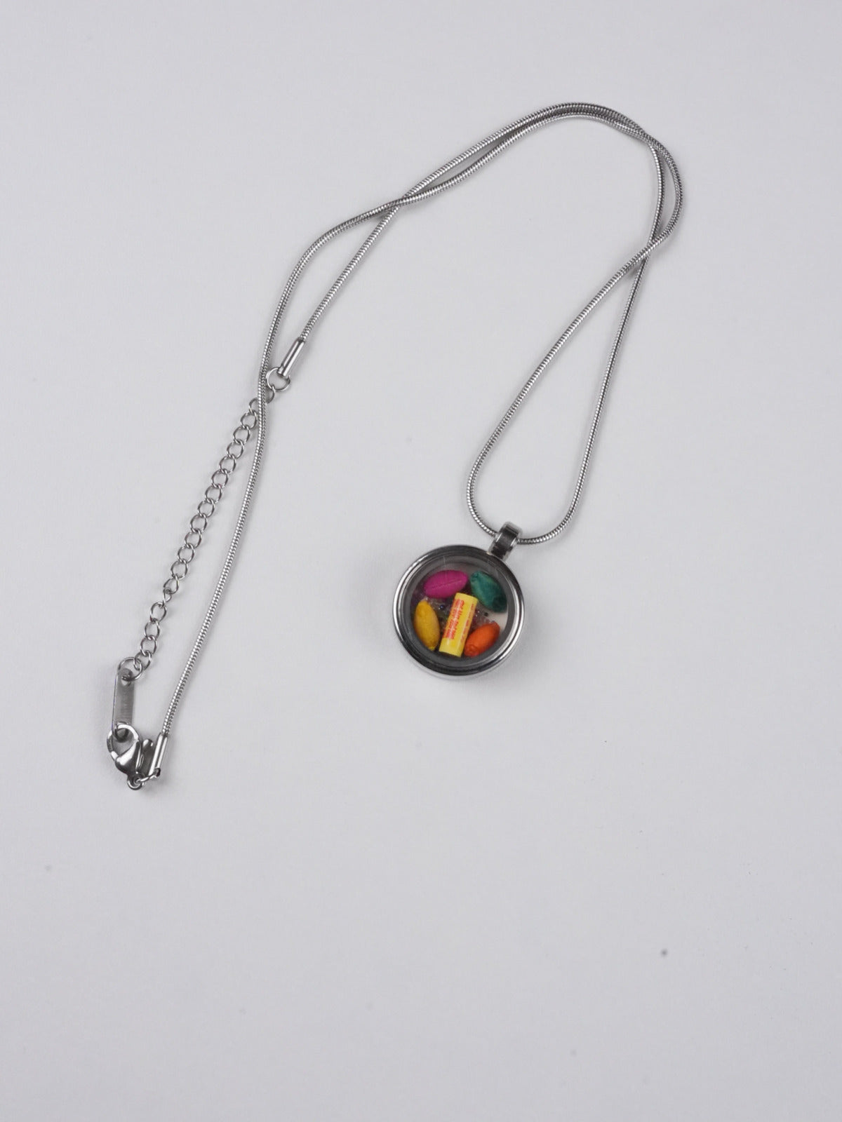 Rainbow-inspired tibetan-buddhist thangka pendant with candy hues, a handcrafted Buddha art amulet bringing color, happiness, and mindfulness to daily life.