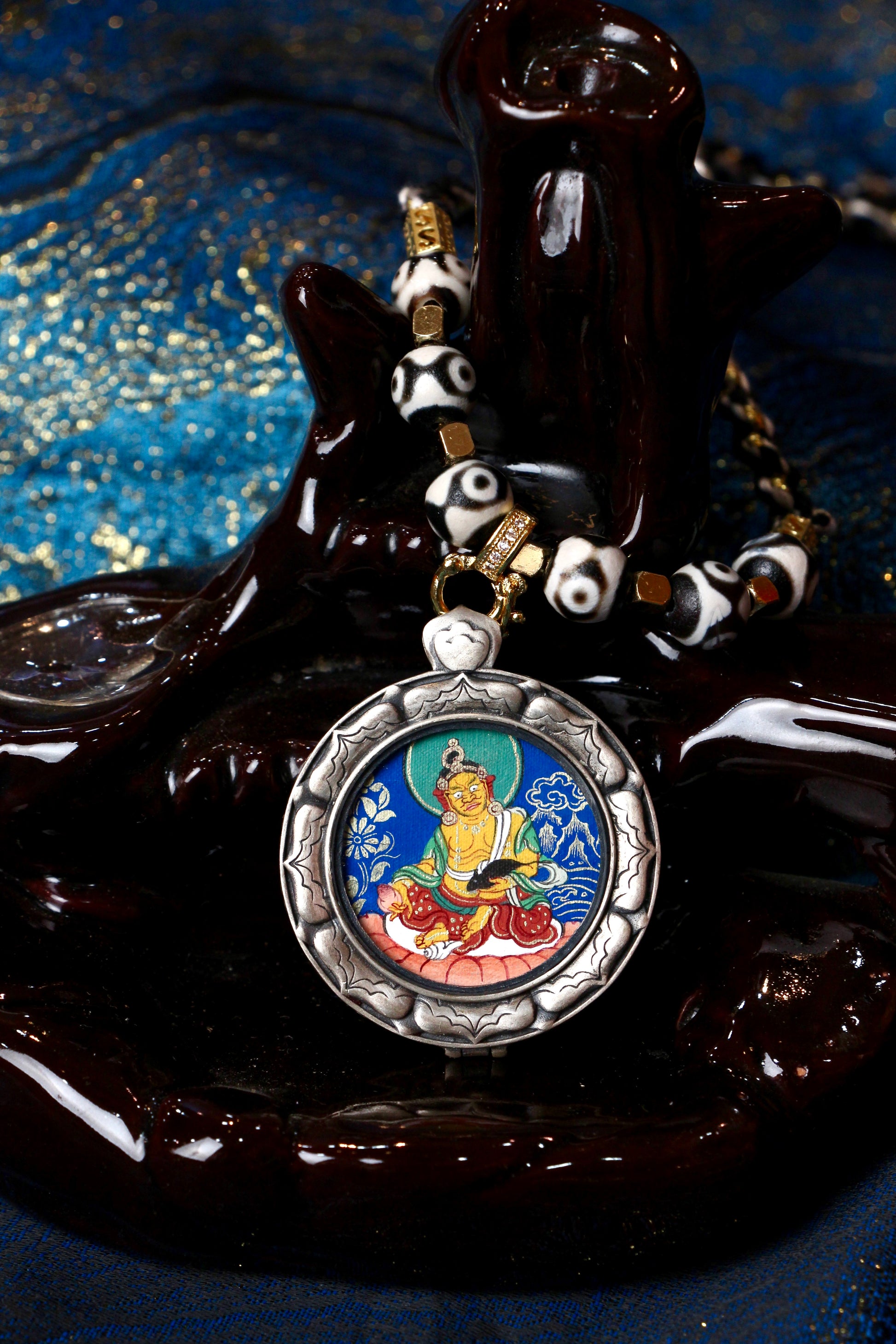 A portable Kurukulla Thangka amulet designed for enhancing charisma, attracting love, and improving professional relationships.