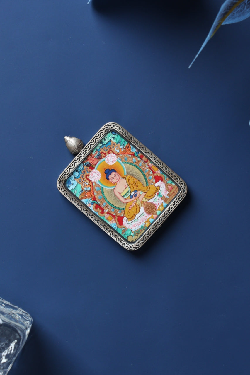 Close-up of the handcrafted S925 silver casing with Dunhuang Nine-Colored Deer relief, protecting the sacred Amitabha artwork.