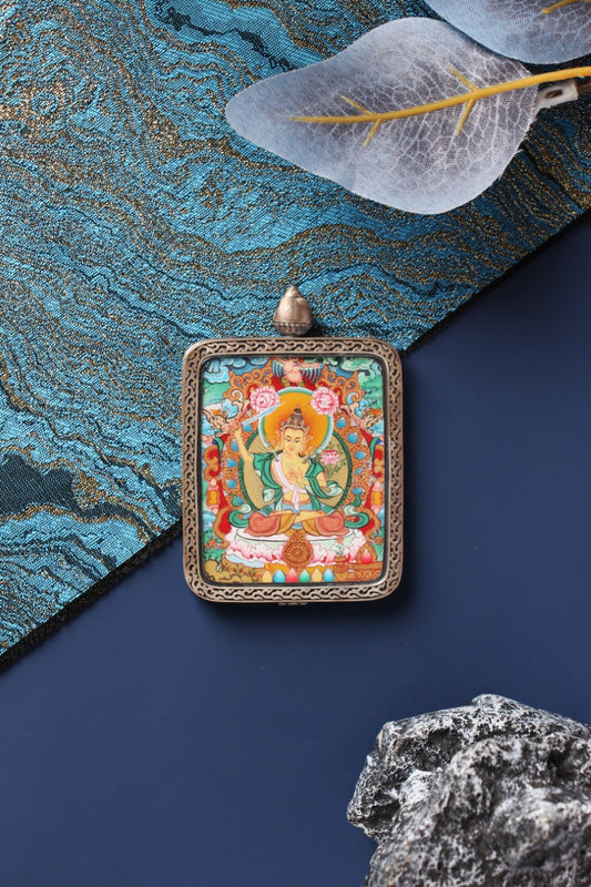 The Manjushri Bodhisattva Thangka pendant, identified as the spiritual guardian for those born in the Year of the Rabbit.