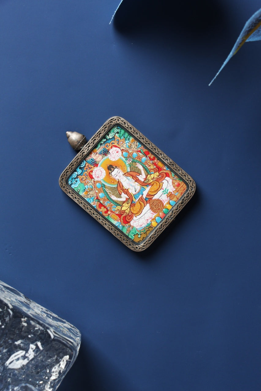 Detail of the S925 silver casing with the Dunhuang Nine-Colored Deer relief on the Avalokiteshvara Thangka pendant.