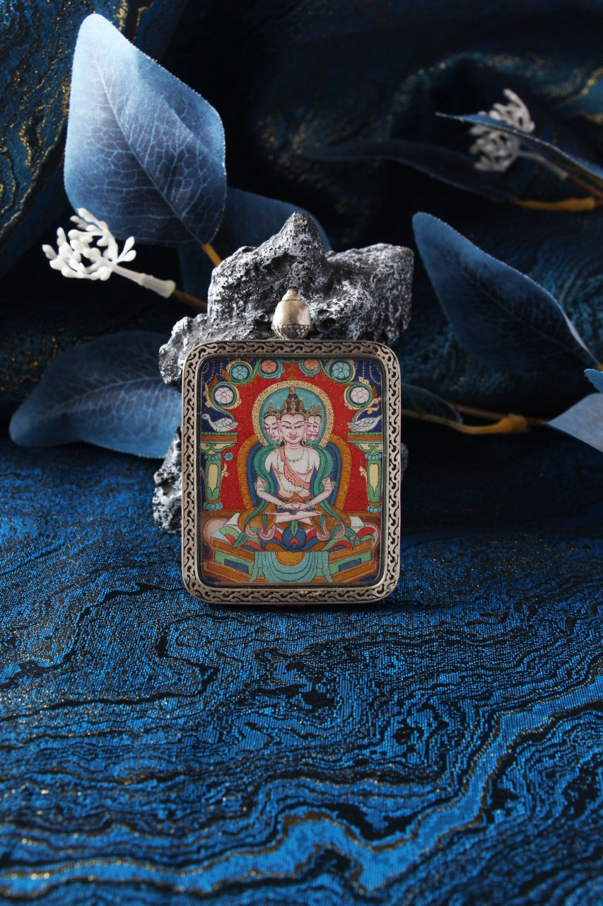 Various Chigang style Thangka pendants showcasing the uniform silver casing and different Buddhist deities.